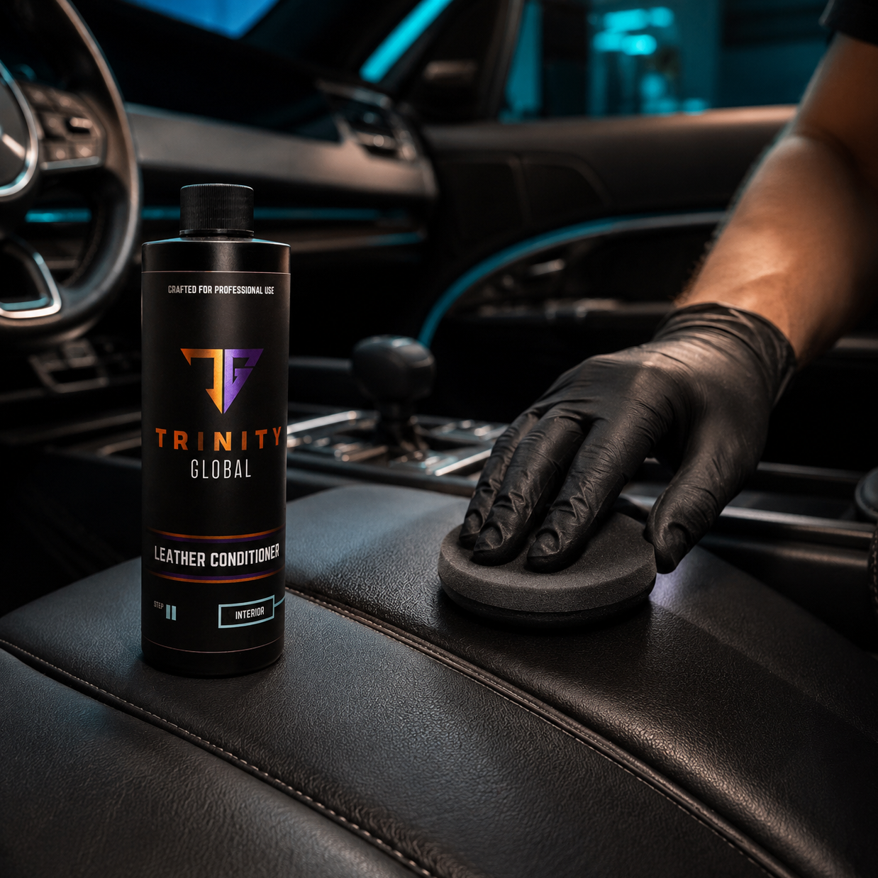 Person applying leather conditioner to car interior with Trinity Global product visible